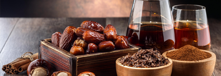 Background images of dates, rum, walnuts, chestnuts, spices, cocoa for Air & Weather's Ralegh Gold fragrance.